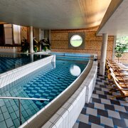 Pool with waterfall and bench